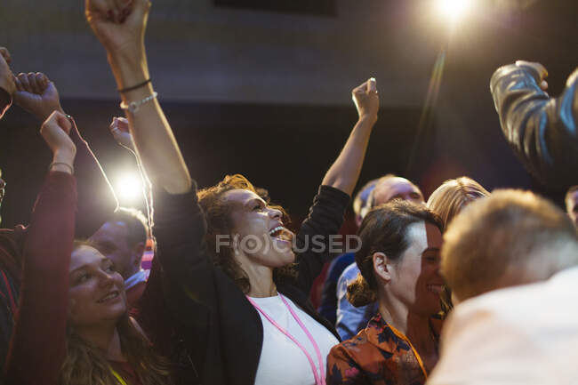 Enthusiastic woman cheering in audience — Stock Photo