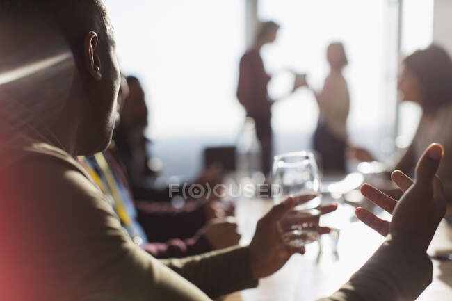 Businessman talking and gesturing in conference room meeting — Stock Photo