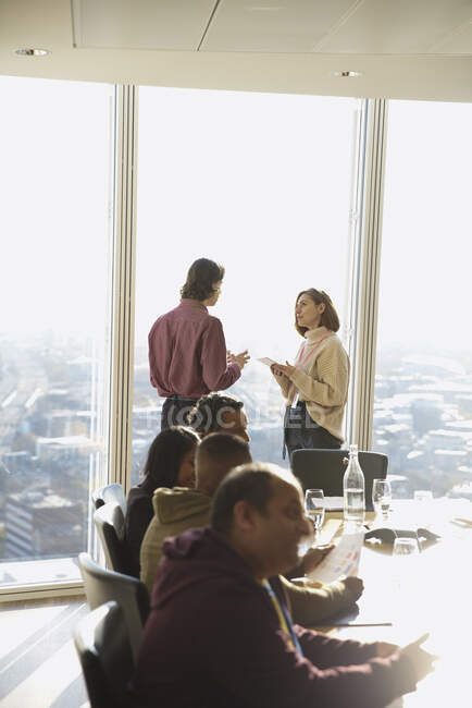 Business people talking in office lounge — Stock Photo