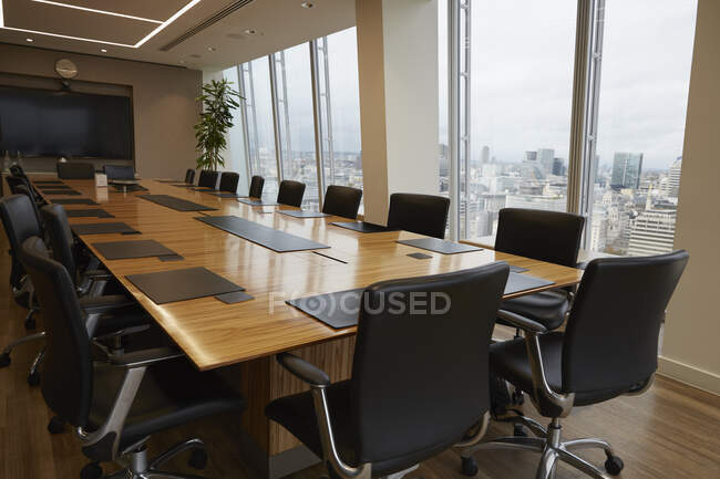 Modern conference room table overlooking city — Stock Photo