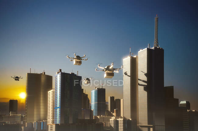 Drones entregando pacotes sobre a cidade ao pôr do sol, Londres, Reino Unido — Fotografia de Stock