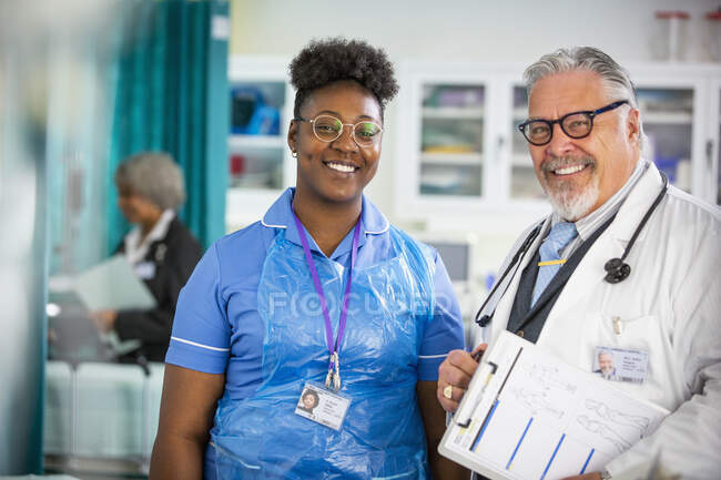 Portrait confident doctor and nurse in hospital — Stock Photo