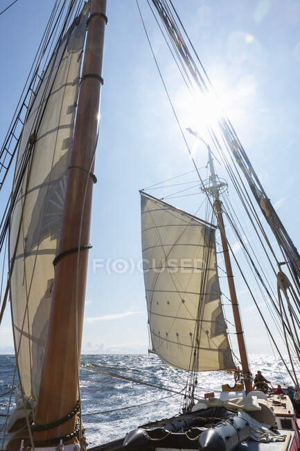 Sailboat sails and mast on sunny ocean Greenland — Stock Photo