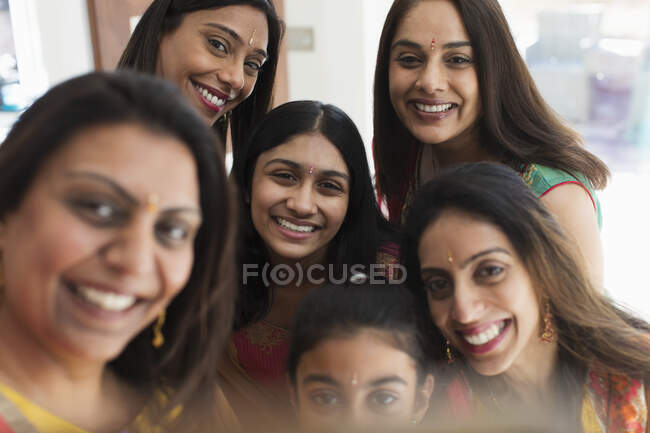 Portrait happy Indian women with bind forehead jewels — Stock Photo