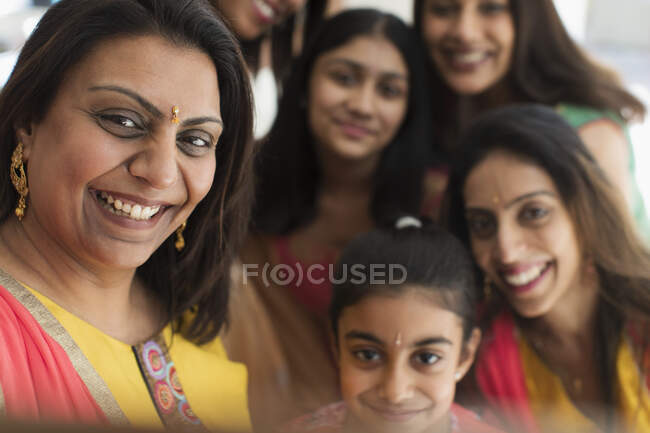 Happy Indian women and girls in bindis — Stock Photo