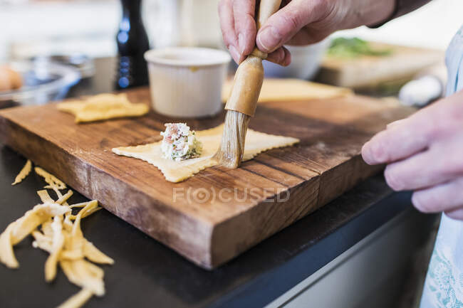 Close up woman making homemade ravioli — Stock Photo