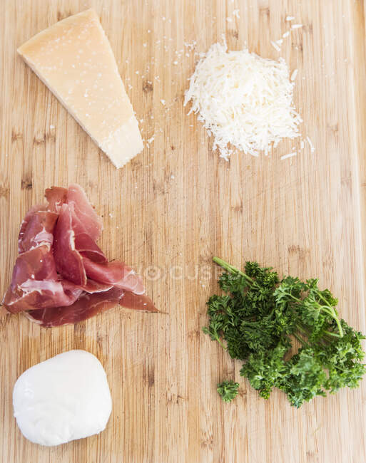Fresh pasta ingredients on cutting board — Stock Photo