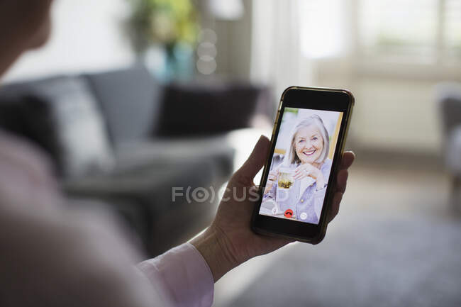 Senior women video chatting with smart phone — Stock Photo