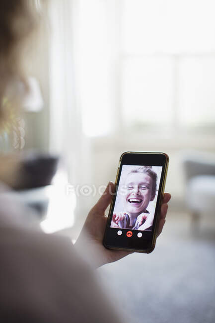 Happy women friends video chatting on smart phone screen — Stock Photo