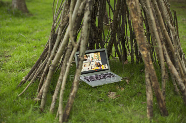 Video conference on laptop screen in branch teepee — Stock Photo