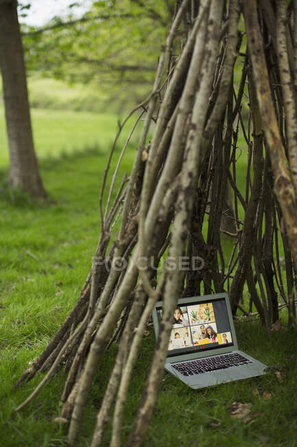 Video conference on laptop screen in branch teepee — Stock Photo