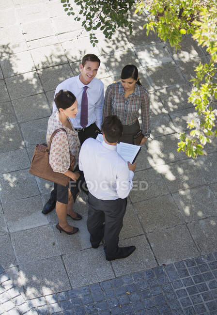Business people talking outdoors — Stock Photo