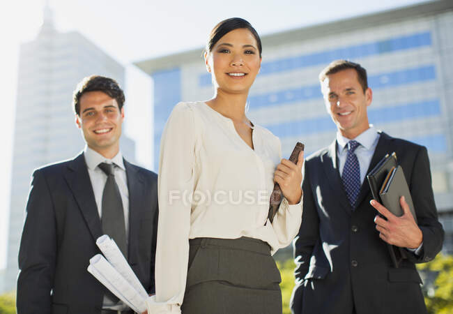 Smiling architects outside urban building — Stock Photo