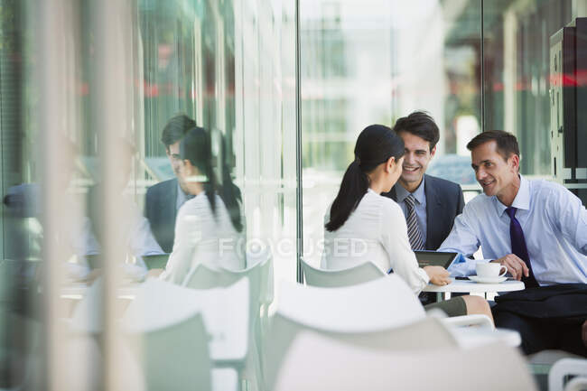 Business people working at cafe — Stock Photo