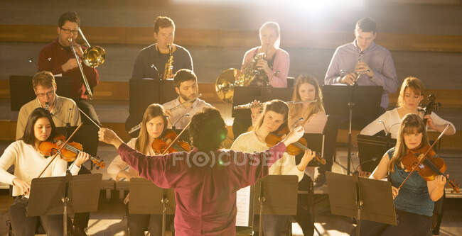 View of Conductor leading orchestra — Stock Photo