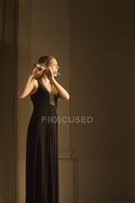 Flutist performing on stage — Stock Photo