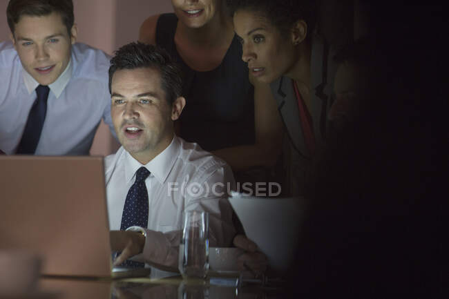 Business people working at laptop in conference room — Stock Photo