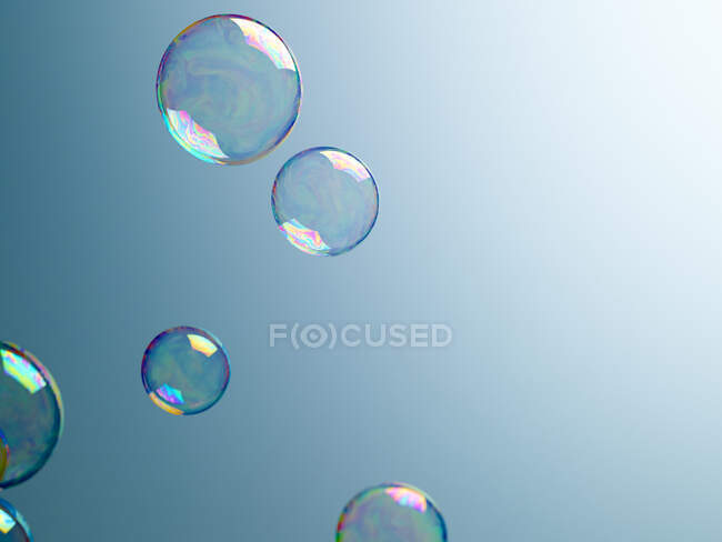 Translucent bubbles on blue background — Stock Photo