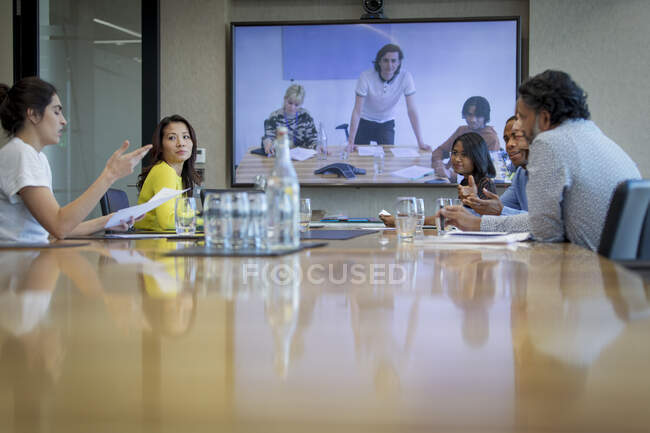 Business people video conferencing in conference room meeting — Stock Photo