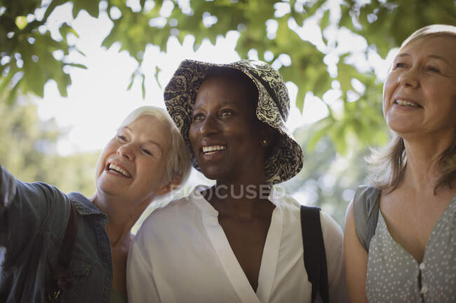Happy senior women friends in park — Stock Photo