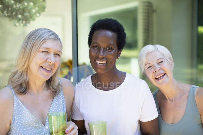 Portrait beautiful happy senior women on patio — Stock Photo