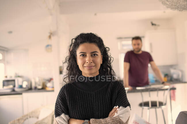 Portrait confident beautiful woman in kitchen at home — Stock Photo