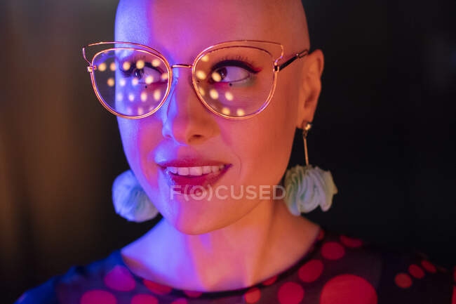 Close up portrait stylish woman in retro eyeglasses looking away — Stock Photo