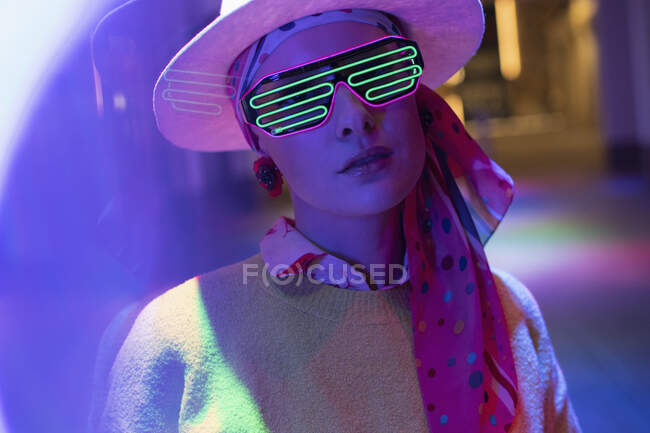 Portrait stylish woman with neon glasses — Stock Photo