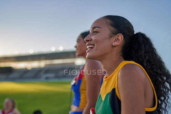 Happy female track and field athlete laughing — Stock Photo