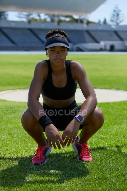 Portrait confident determined female track and field athlete — Stock Photo