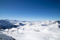 Ski lift gondolas and poles at ski resort — Stock Photo