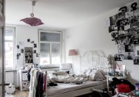 August 1, 2016. Konstanz. Messy adolescent bedroom with photos on walls — Stock Photo