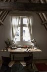 August 5, 2016. Belgium, Antwerp. Table with books near window indoors — Stock Photo