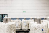 March 1, 2017. Italy, Valle Mosso, Biella, Reda. White wool reels in storage room of textile factory — Stock Photo