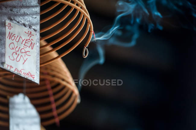 Burning spiral incense stick in temple — Stock Photo