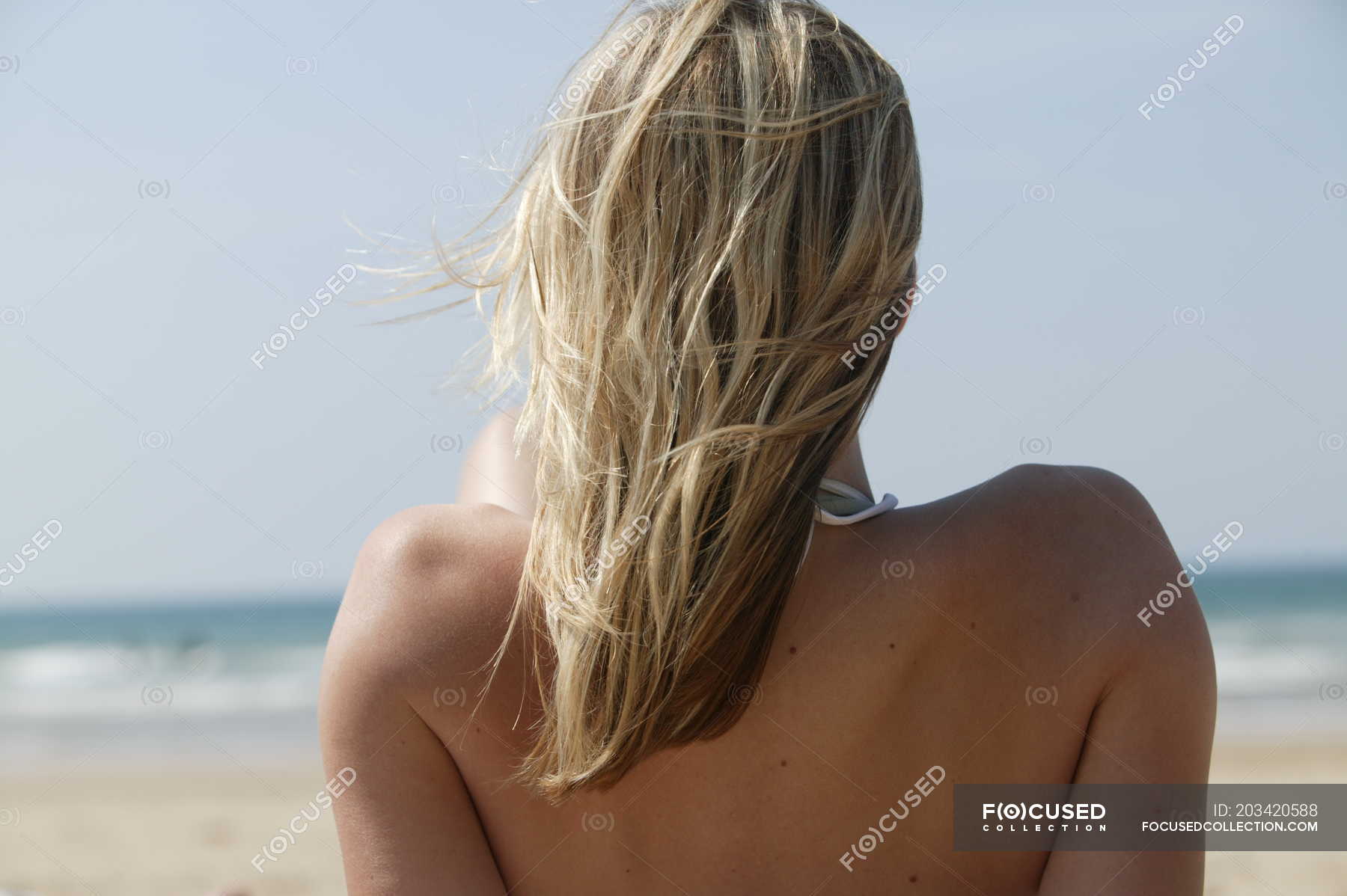 Blonde Hair Woman On Beach Relaxing View Holiday Stock Photo