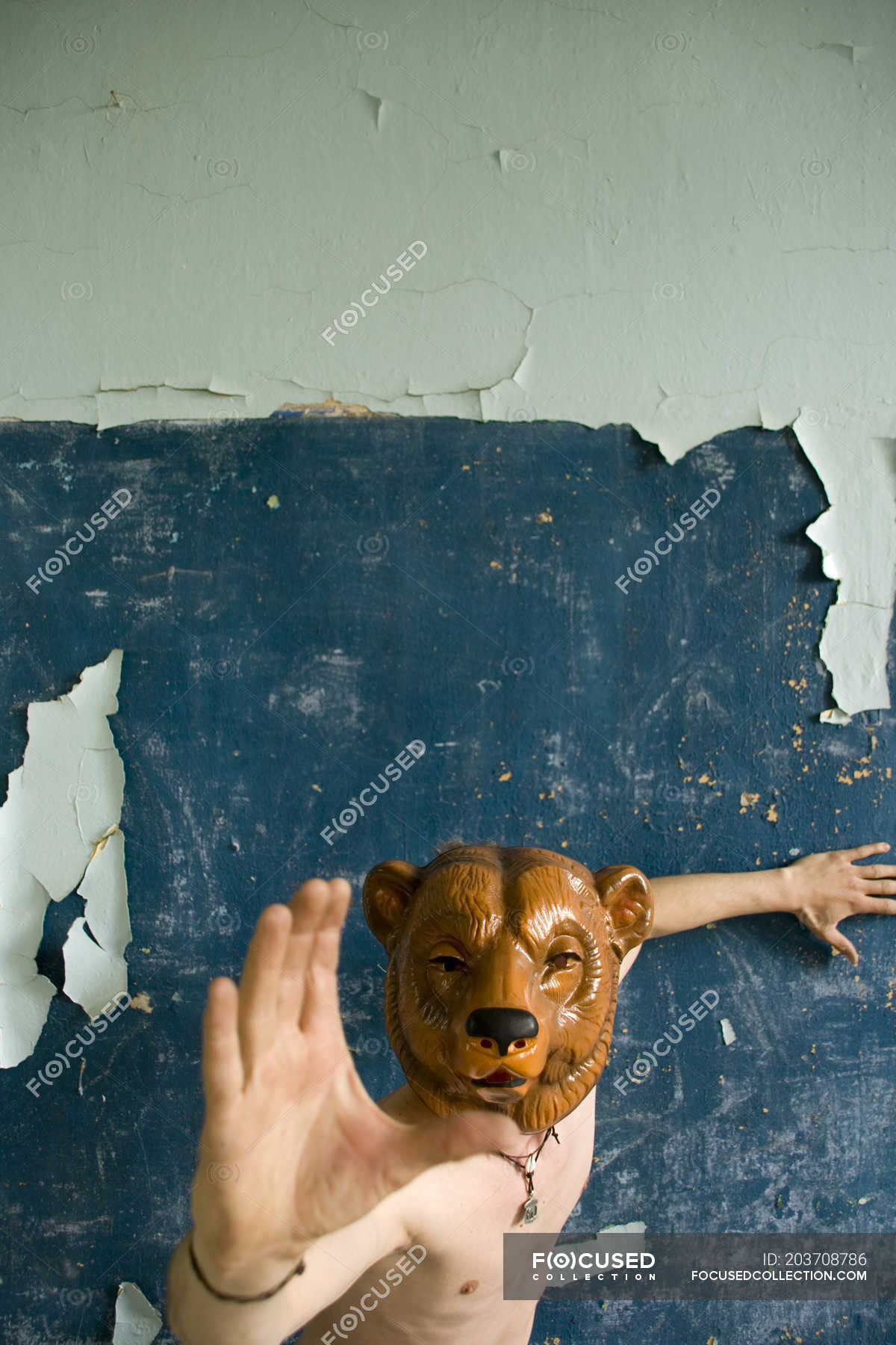Man Wearing Bear Mask On Face And Attack While Standing At Old