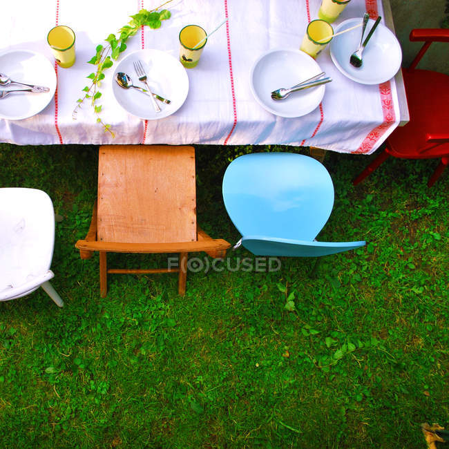 Children Table For Picnic And Colorful Chairs Plates Cups