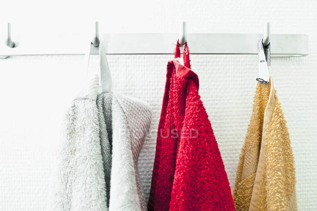 Towels Hanging In A Row On Hooks Still Life Three Objects Towels Hanging In A Row On Hooks Still Life Three Objects