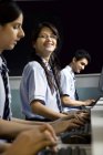 Portrait of a student in a computer lab — Stock Photo