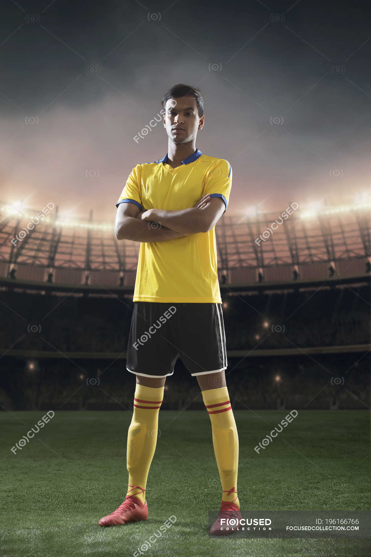 Football player standing portrait with stadium at background — sportsman,  vertical - Stock Photo | #196166766