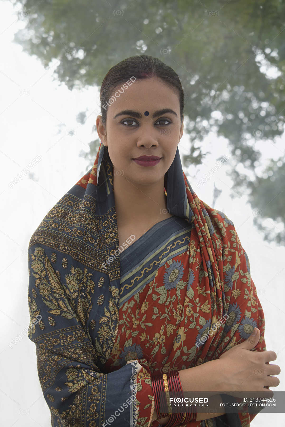 Portrait Of Village Woman In Sari Looking At Camera Outdoors — Standing 