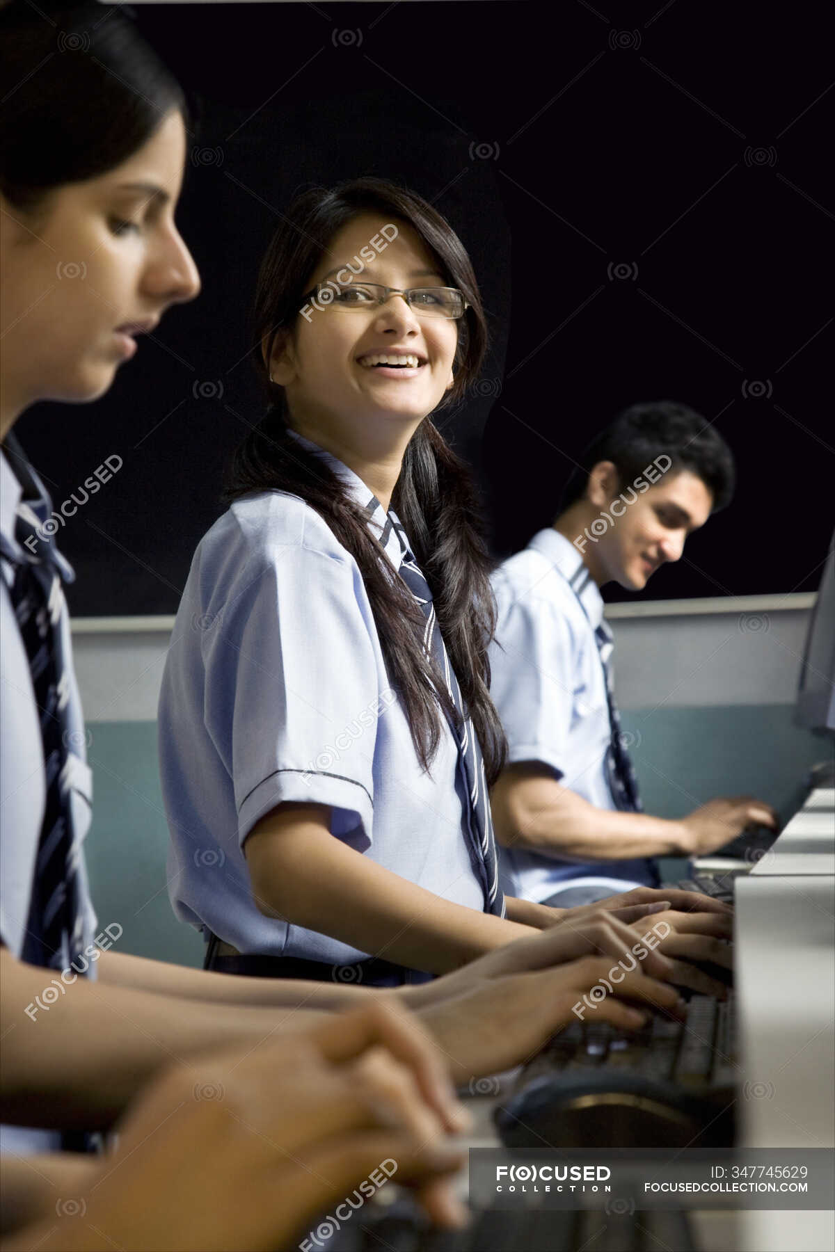 Portrait of a student in a computer lab — students, school uniform ...