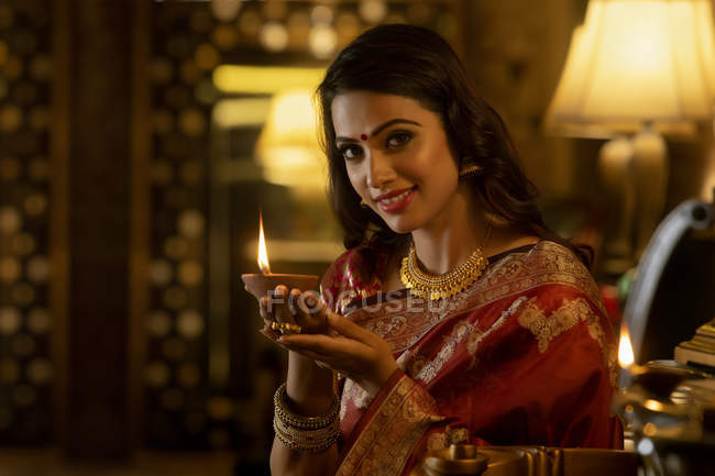 Portrait of a woman with a diya — Stock Photo