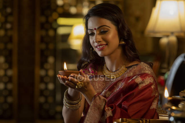 Portrait of a woman with a diya — Stock Photo