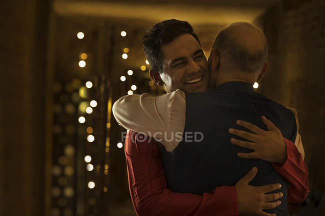 Father and son greeting each other with a hug — Stock Photo