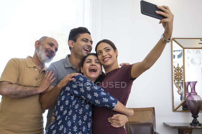 A family is clicking a selfie together. — Stock Photo