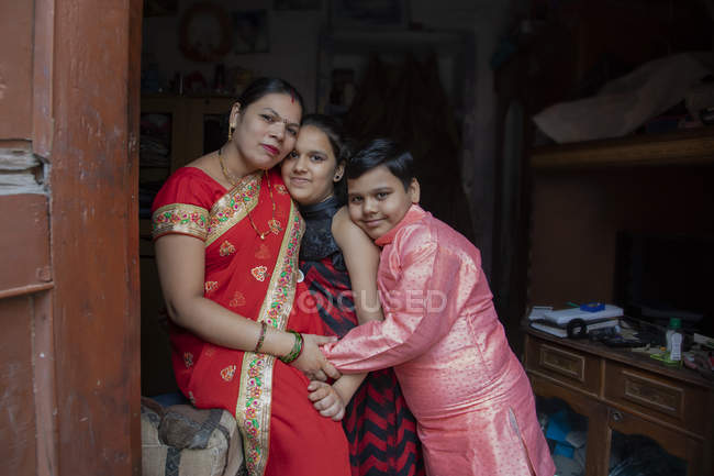 Mother sitting with her children — Stock Photo