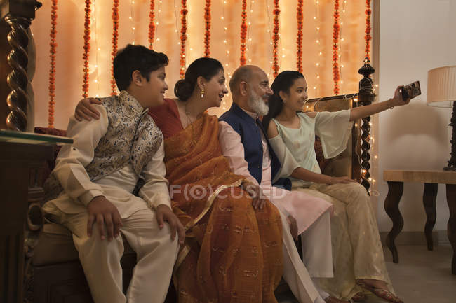 Children clicking selfie with their grandparents on Diwali — Stock Photo
