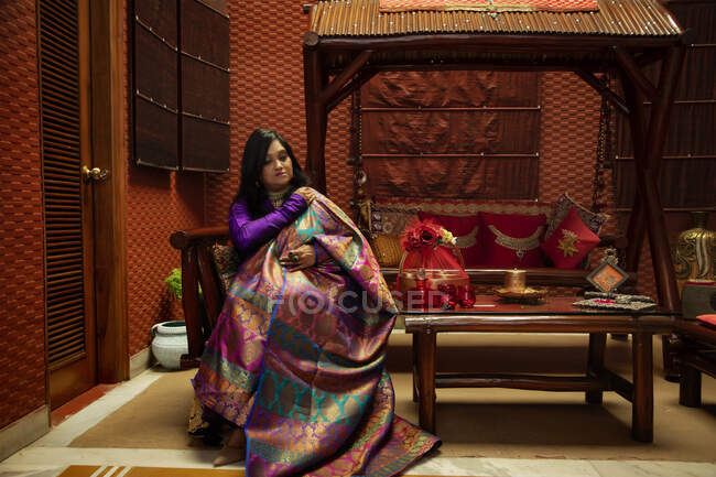 Woman draping her colourful dupatta. — Stock Photo